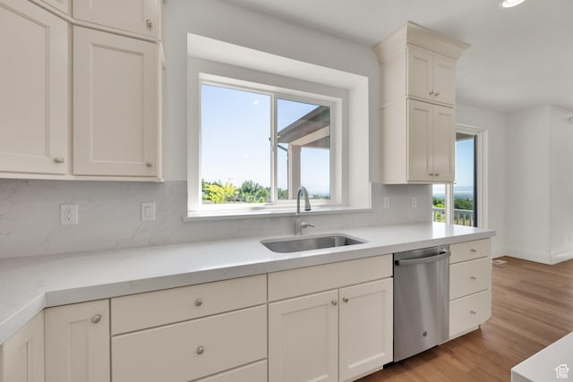 1378 E Orchard Ridge Ln, Kaysville, UT 84037 - kitchen with dishwasher, decorative backsplash, healthy amount of natural light, and light countertops