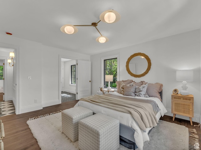 1499 E River Oaks Dr, Sandy, UT 84093 - bedroom featuring wood finished floors and baseboards