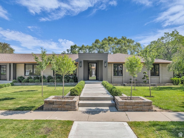 1499 E River Oaks Dr, Sandy, UT 84093 - view of front of home featuring a front lawn and brick siding