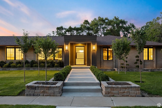 1499 E River Oaks Dr, Sandy, UT 84093 - view of front of home featuring brick siding, a front yard, and a shingled roof