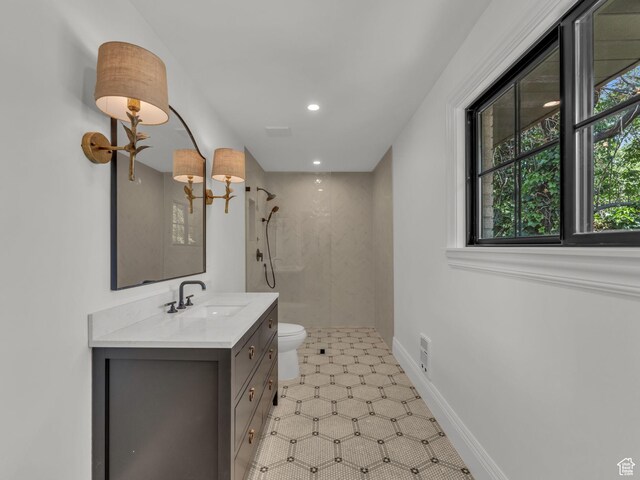 1499 E River Oaks Dr, Sandy, UT 84093 - bathroom with a tile shower, vanity, recessed lighting, and tile patterned floors
