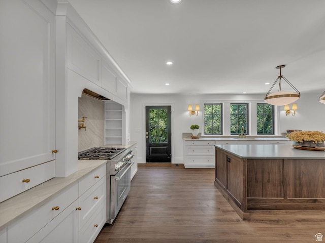 1499 E River Oaks Dr, Sandy, UT 84093 - kitchen featuring stainless steel range, healthy amount of natural light, recessed lighting, dark wood-style flooring, and light countertops