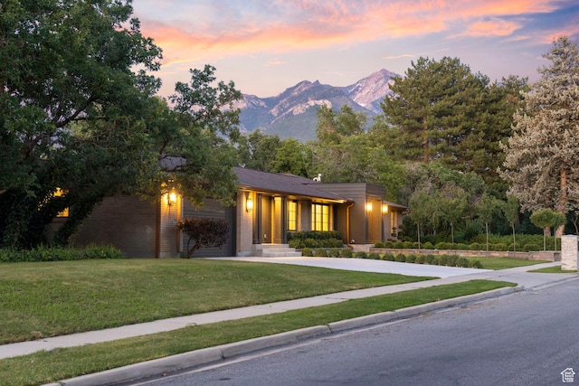 1499 E River Oaks Dr, Sandy, UT 84093 - view of front of home featuring driveway, a front lawn, and a mountain view