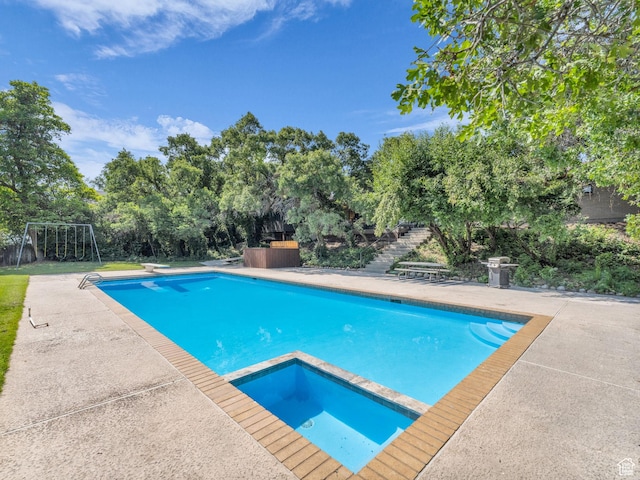 1499 E River Oaks Dr, Sandy, UT 84093 - view of pool featuring view of scattered trees, a patio, stairway, a pool with connected hot tub, and a diving board