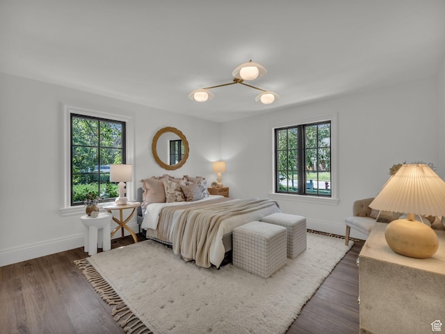 1499 E River Oaks Dr, Sandy, UT 84093 - bedroom with multiple windows and wood finished floors