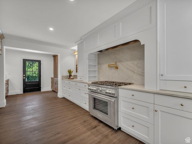 1499 E River Oaks Dr, Sandy, UT 84093 - kitchen with high end stove, light countertops, backsplash, white cabinetry, and recessed lighting