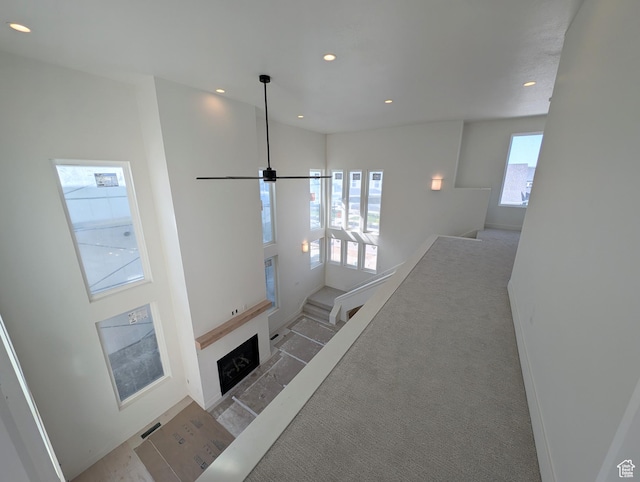 7083 W Granbury Dr S Unit 256, South Jordan, UT 84009 - stairway with recessed lighting, a ceiling fan, and a fireplace