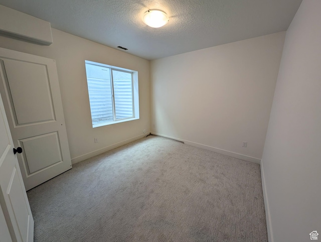 7083 W Granbury Dr S Unit 256, South Jordan, UT 84009 - unfurnished room featuring a textured ceiling and carpet flooring