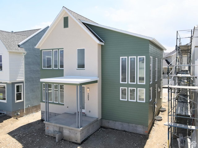 7083 W Granbury Dr S Unit 256, South Jordan, UT 84009 - back of house featuring stucco siding