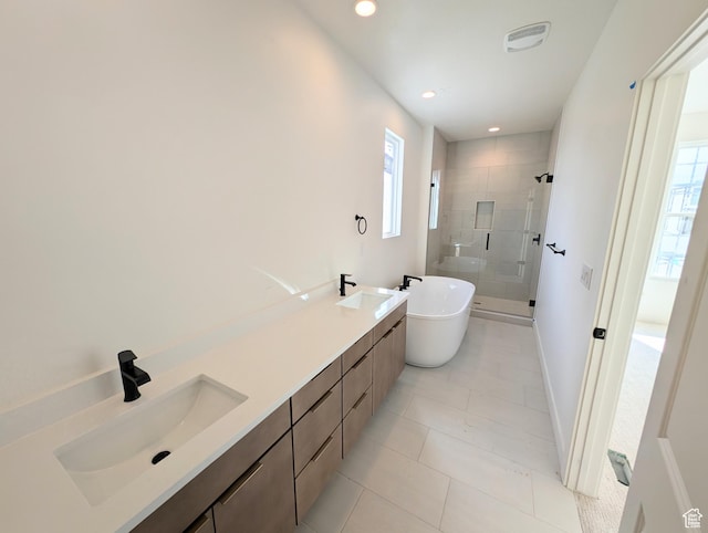 7083 W Granbury Dr S Unit 256, South Jordan, UT 84009 - bathroom featuring a stall shower, a soaking tub, plenty of natural light, double vanity, and recessed lighting