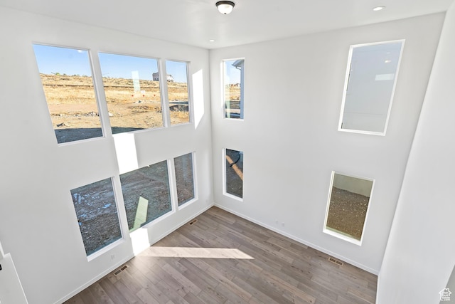6941 W Farnsworth Peak Dr S Unit 316, West Jordan, UT 84081 - spare room with wood finished floors and recessed lighting