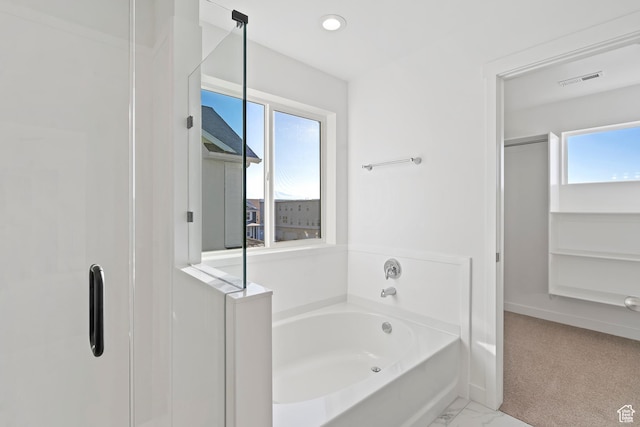 6941 W Farnsworth Peak Dr S Unit 316, West Jordan, UT 84081 - full bath featuring a garden tub, marble look tile flooring, and a stall shower