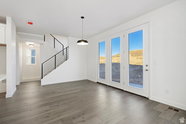 6941 W Farnsworth Peak Dr S Unit 316, West Jordan, UT 84081 - unfurnished living room featuring stairway and wood finished floors