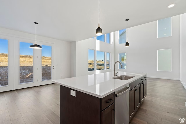 6941 W Farnsworth Peak Dr S Unit 316, West Jordan, UT 84081 - kitchen featuring stainless steel dishwasher, plenty of natural light, dark brown cabinetry, light countertops, and recessed lighting