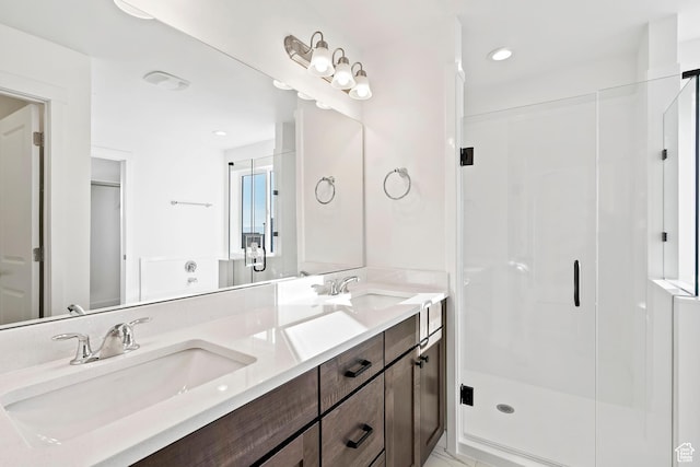 6941 W Farnsworth Peak Dr S Unit 316, West Jordan, UT 84081 - full bathroom featuring double vanity, a stall shower, and recessed lighting