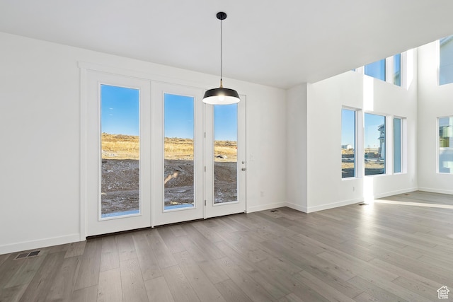 6941 W Farnsworth Peak Dr S Unit 316, West Jordan, UT 84081 - unfurnished dining area with wood finished floors and baseboards