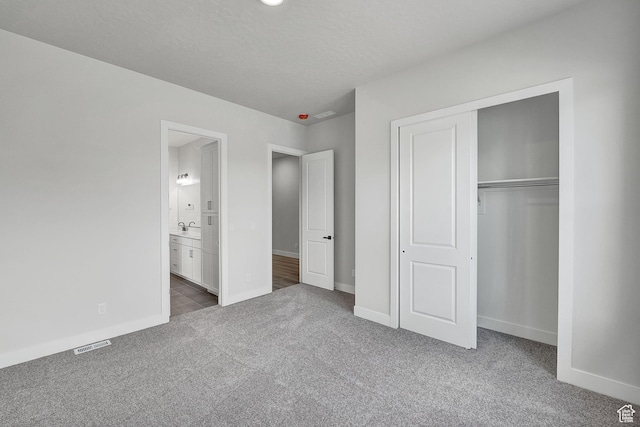 6199 W Wapiti Ridge Ln Unit 333, Herriman, UT 84096 - unfurnished bedroom with carpet floors, a closet, and ensuite bath