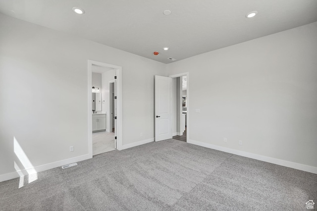 6199 W Wapiti Ridge Ln Unit 333, Herriman, UT 84096 - unfurnished bedroom featuring carpet, recessed lighting, and ensuite bath