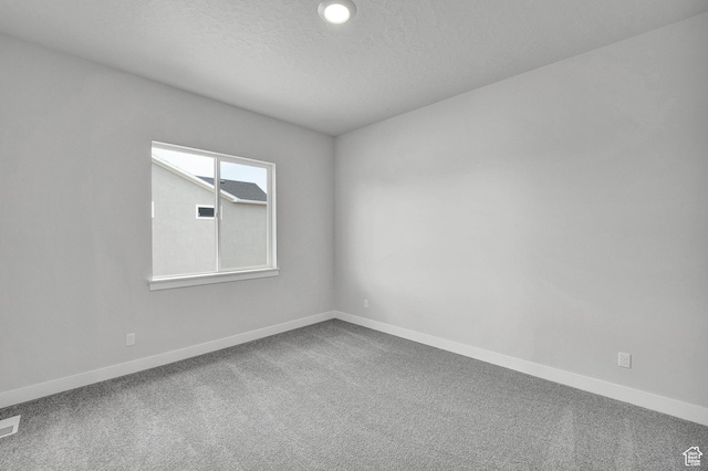 6199 W Wapiti Ridge Ln Unit 333, Herriman, UT 84096 - carpeted spare room featuring baseboards and a textured ceiling