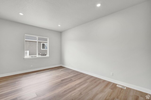 6199 W Wapiti Ridge Ln Unit 333, Herriman, UT 84096 - unfurnished room featuring wood finished floors and recessed lighting