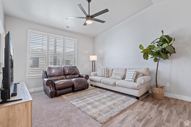14642 S Mckellen Dr Unit C303, Herriman, UT 84096 - living room featuring lofted ceiling, ceiling fan, a textured ceiling, and wood finished floors
