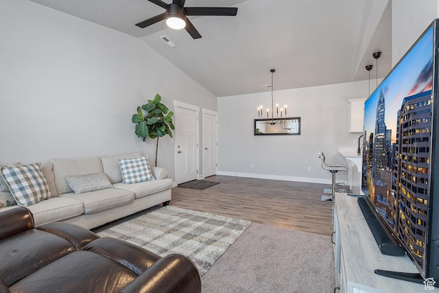 14642 S Mckellen Dr Unit C303, Herriman, UT 84096 - living room with a chandelier, lofted ceiling, ceiling fan, and wood finished floors