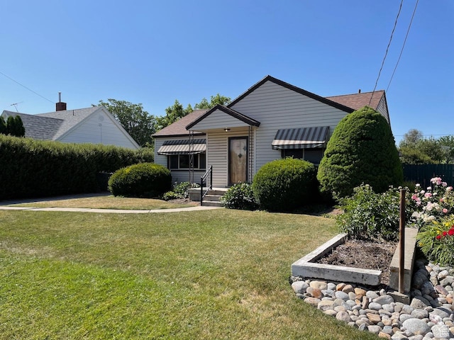 115 W Lester Ave, Murray, UT 84107 - bungalow-style home featuring a front yard and roof with shingles