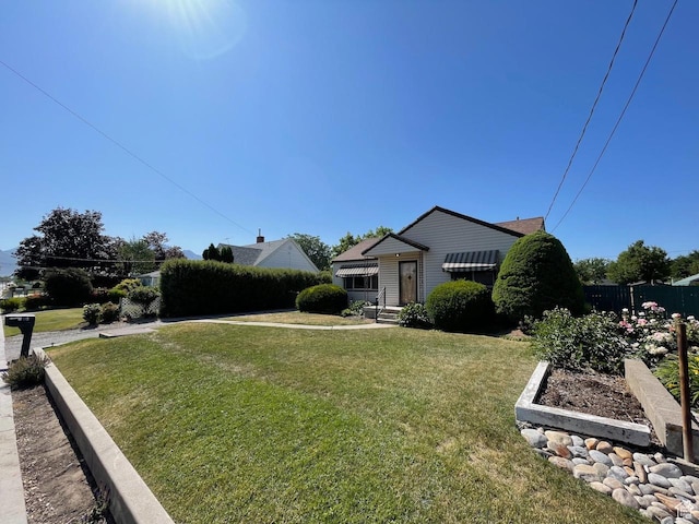 115 W Lester Ave, Murray, UT 84107 - view of front of house featuring a garden