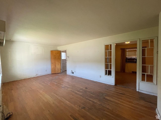 115 W Lester Ave, Murray, UT 84107 - unfurnished room with wood finished floors and cooling unit