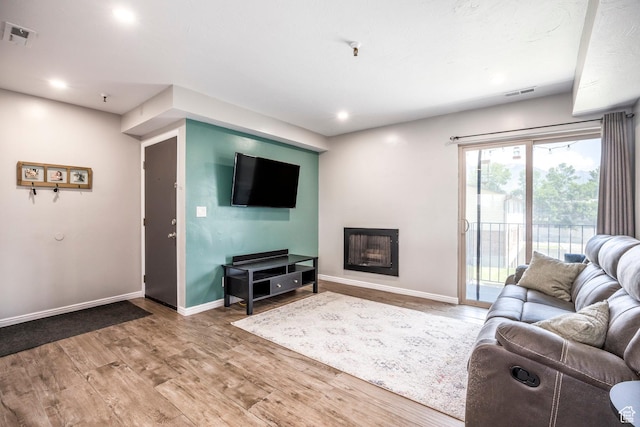 1108 E 6600 S Unit B3, Murray, UT 84121 - living room with wood finished floors, a fireplace, and recessed lighting