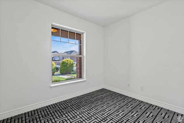 1076 W River Hill Dr, Spanish Fork, UT 84660 - spare room featuring baseboards and brick patterned floors
