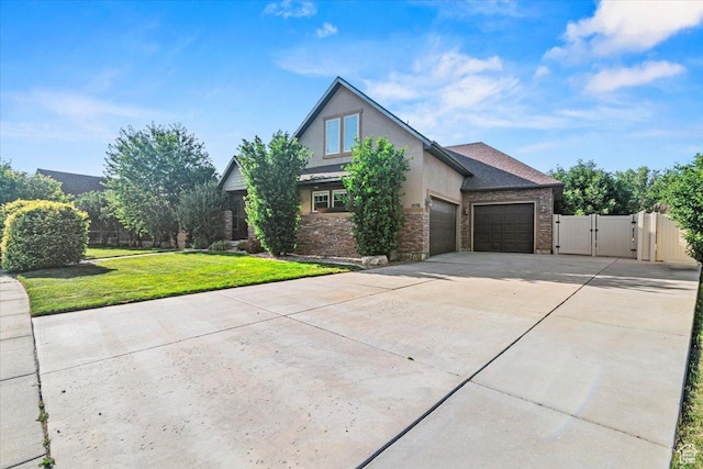 1076 W River Hill Dr, Spanish Fork, UT 84660 - view of front of home with a gate, a garage, driveway, stucco siding, and stone siding