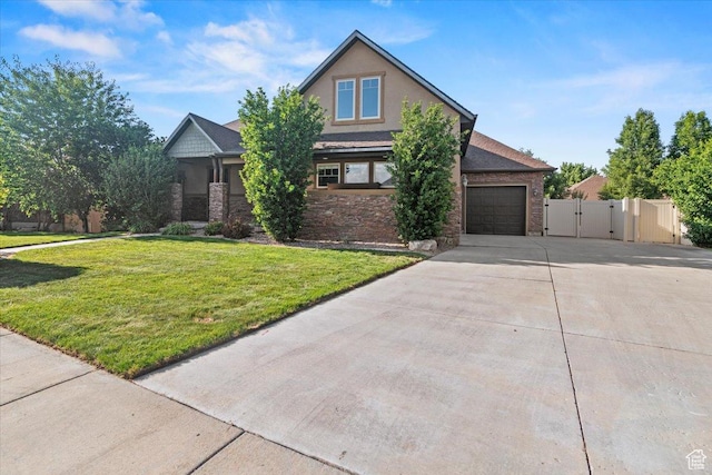 1076 W River Hill Dr, Spanish Fork, UT 84660 - view of front of house with driveway, a gate, stone siding, and a garage