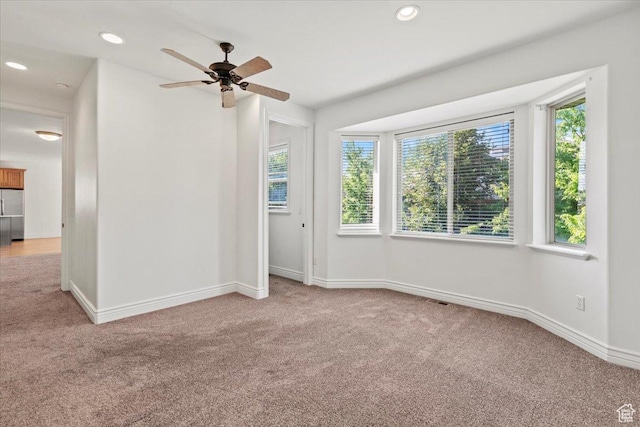 1076 W River Hill Dr, Spanish Fork, UT 84660 - empty room featuring light carpet, plenty of natural light, ceiling fan, and recessed lighting