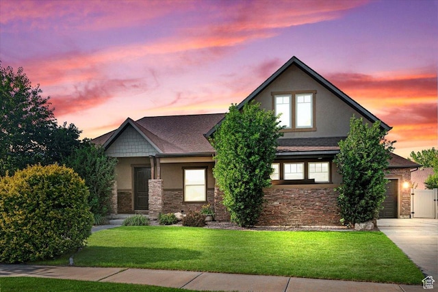 1076 W River Hill Dr, Spanish Fork, UT 84660 - view of front of house featuring stone siding, stucco siding, driveway, a front yard, and roof with shingles