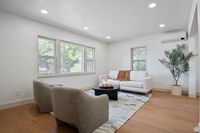1214 E Parkway Ave, Salt Lake City, UT 84106 - living room with an AC wall unit, recessed lighting, and light wood-style floors