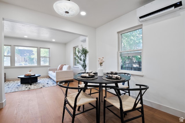 1214 E Parkway Ave, Salt Lake City, UT 84106 - dining space featuring a wall mounted AC, healthy amount of natural light, wood finished floors, and recessed lighting