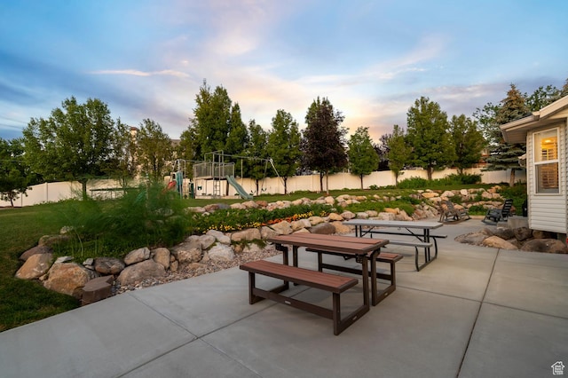 302 W 730 S, Tooele, UT 84074 - patio terrace at dusk featuring a patio area and a playground