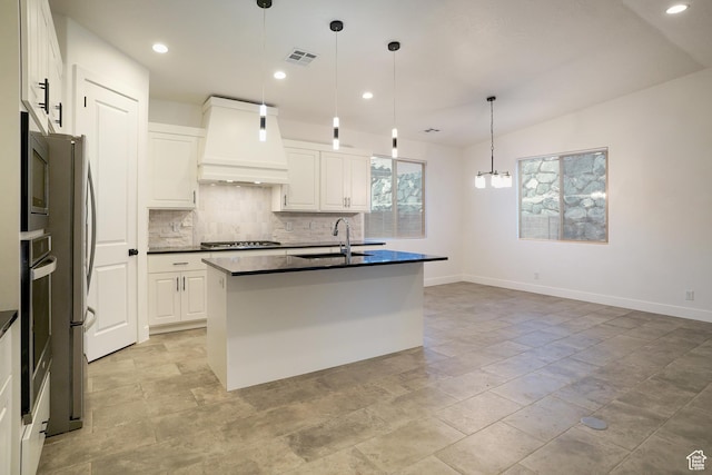 350 W Camino Borde, Washington, UT 84780 - kitchen with premium range hood, dark countertops, decorative backsplash, white cabinetry, and appliances with stainless steel finishes