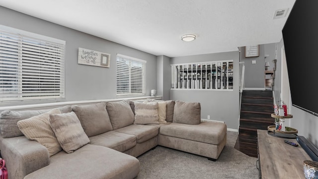 4878 S 3450 W, Roy, UT 84067 - living room featuring carpet floors, a textured ceiling, and stairway