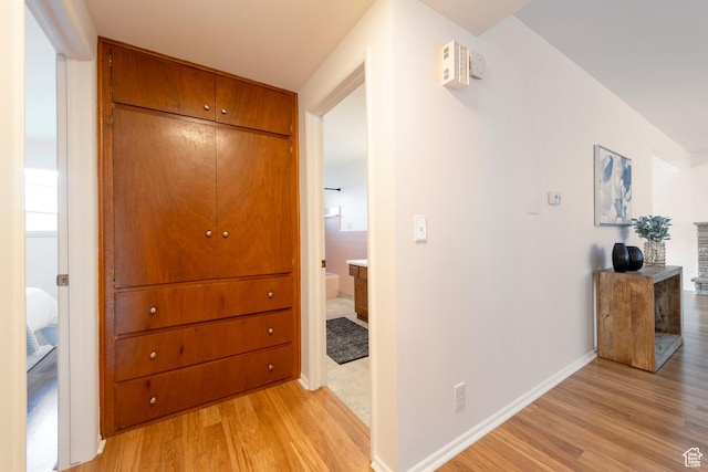 2260 E Murray Holladay Rd S Unit 22, Holladay, UT 84117 - hall with light wood finished floors and baseboards