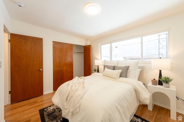 2260 E Murray Holladay Rd S Unit 22, Holladay, UT 84117 - bedroom with a closet and light wood-style floors