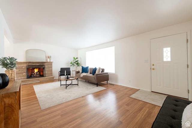 2260 E Murray Holladay Rd S Unit 22, Holladay, UT 84117 - living room featuring plenty of natural light, light wood finished floors, and a fireplace