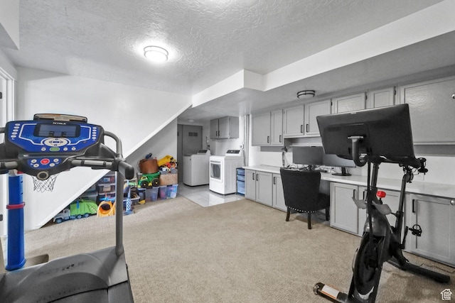 2451 E Cavalier Dr, Cottonwood Heights, UT 84121 - workout room featuring light carpet, a textured ceiling, and washing machine and clothes dryer