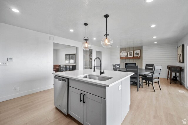 2451 E Cavalier Dr, Cottonwood Heights, UT 84121 - kitchen with dishwasher, recessed lighting, light wood-style floors, a center island with sink, and gray cabinetry