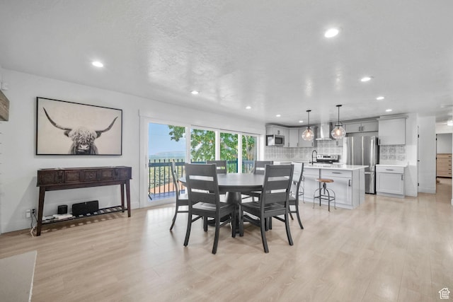 2451 E Cavalier Dr, Cottonwood Heights, UT 84121 - dining space featuring light wood-style floors and recessed lighting