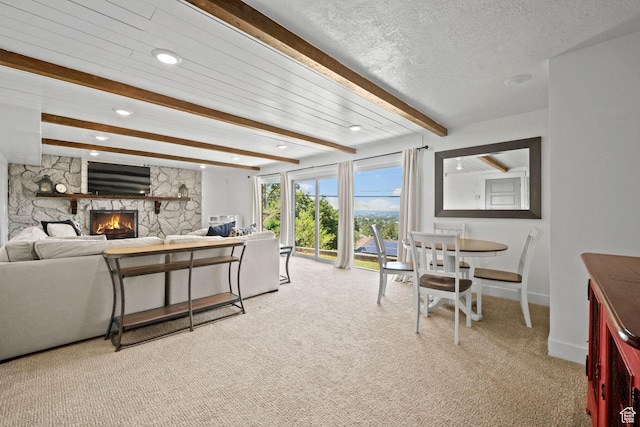 2451 E Cavalier Dr, Cottonwood Heights, UT 84121 - living area featuring beamed ceiling, light carpet, a fireplace, recessed lighting, and a textured ceiling