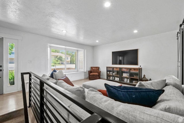 2451 E Cavalier Dr, Cottonwood Heights, UT 84121 - living room with recessed lighting, wood finished floors, and a textured ceiling