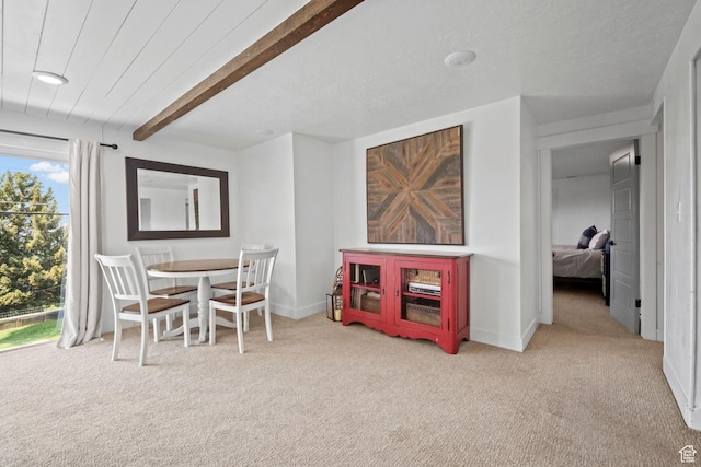 2451 E Cavalier Dr, Cottonwood Heights, UT 84121 - carpeted dining area featuring beamed ceiling and baseboards