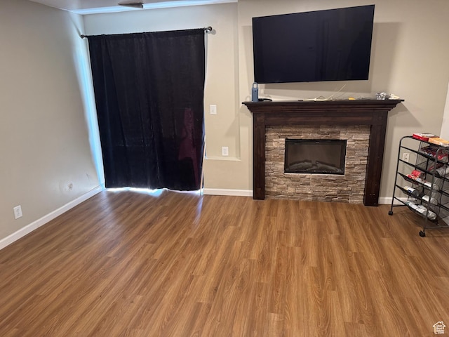 88 W 50 S Unit A4, Centerville, UT 84014 - unfurnished living room featuring a fireplace and wood finished floors